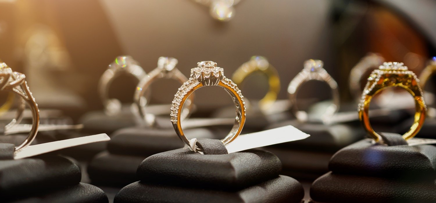 Jewelry diamond rings and necklaces show in luxury retail store window display